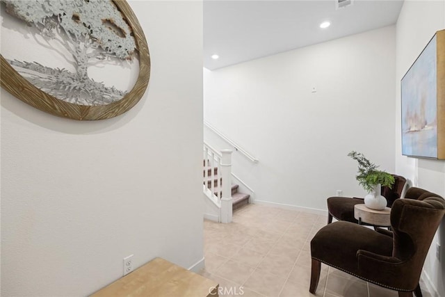 interior space with light tile patterned flooring, baseboards, stairway, and recessed lighting