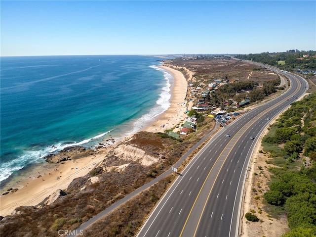 aerial view featuring a water view and a view of the beach