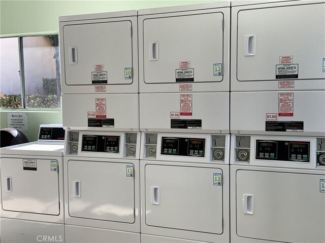 washroom with washer and dryer and stacked washer / dryer