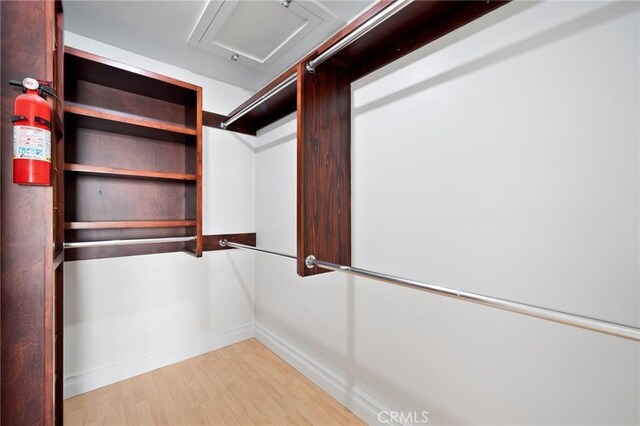 walk in closet featuring light wood-type flooring