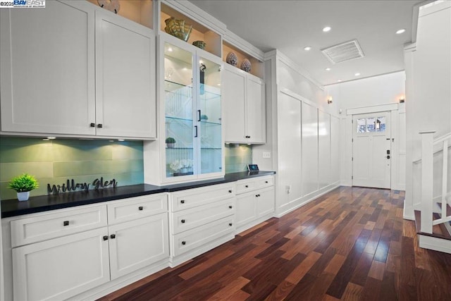 mudroom featuring dark wood-type flooring