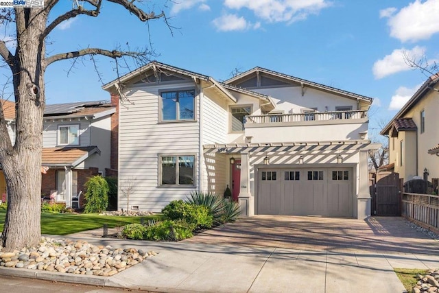 view of front of home featuring a balcony and a garage