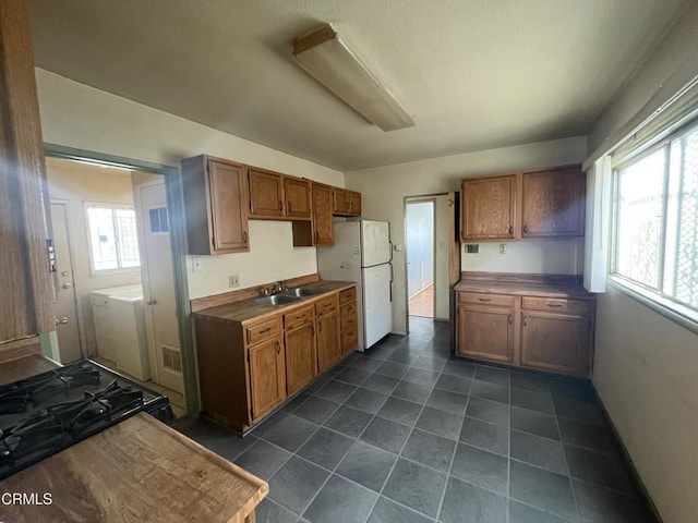 kitchen with white fridge and sink