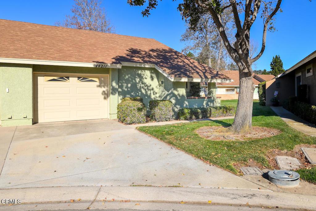 view of front of house with a front yard and a garage