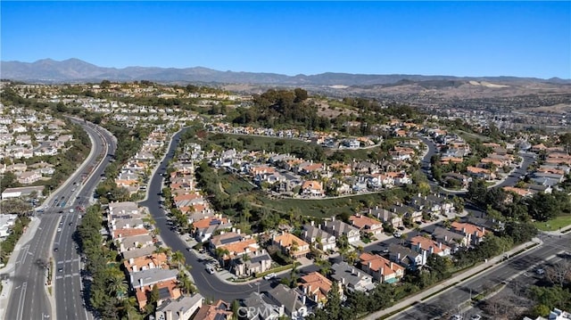 birds eye view of property featuring a mountain view