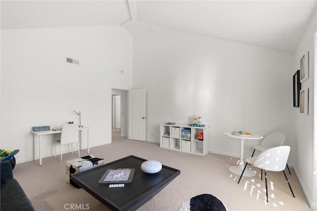 exercise area with high vaulted ceiling and carpet flooring