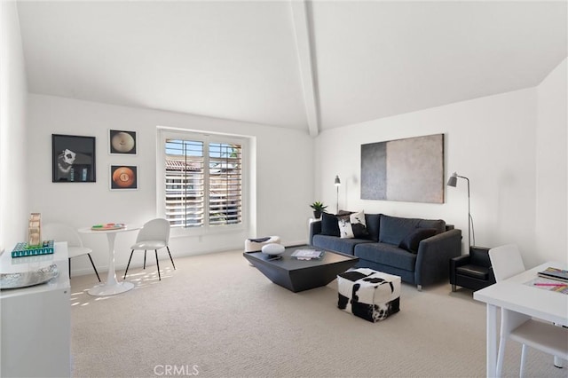 carpeted living room with vaulted ceiling with beams