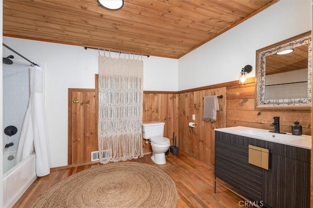 full bathroom featuring toilet, wood walls, wood ceiling, and hardwood / wood-style floors