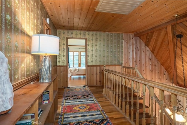 hallway with wood ceiling and hardwood / wood-style floors