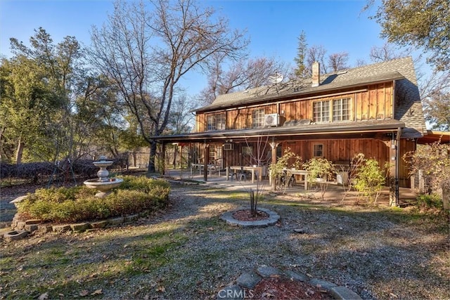 back of house with a patio area