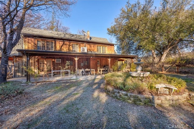 rear view of property with a patio area