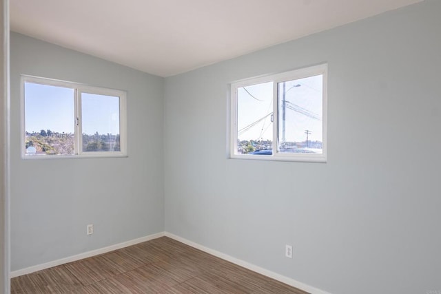 spare room featuring hardwood / wood-style floors