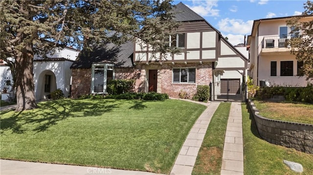 english style home with a front yard