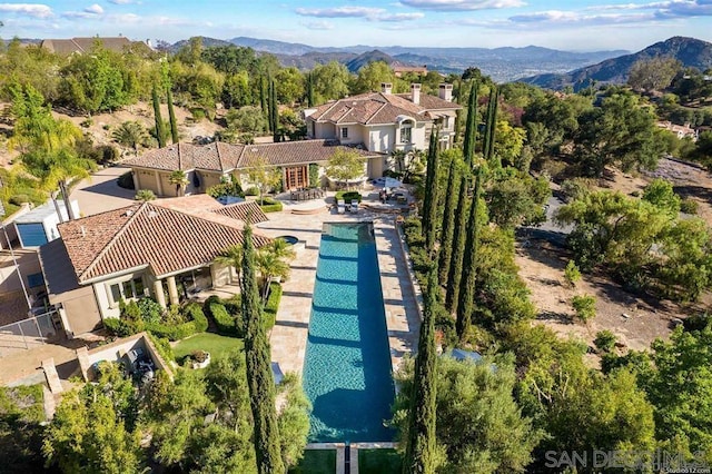 birds eye view of property with a mountain view