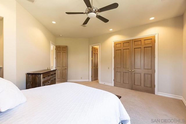 carpeted bedroom with ceiling fan