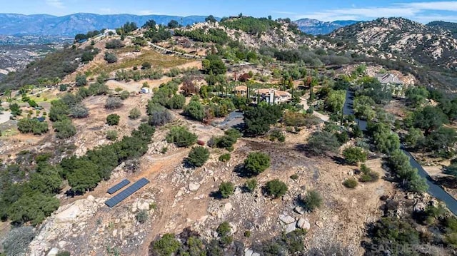 birds eye view of property featuring a mountain view