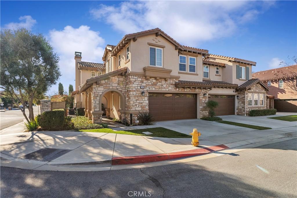 mediterranean / spanish home featuring a garage