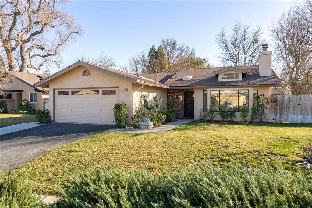 ranch-style house with a front lawn and a garage