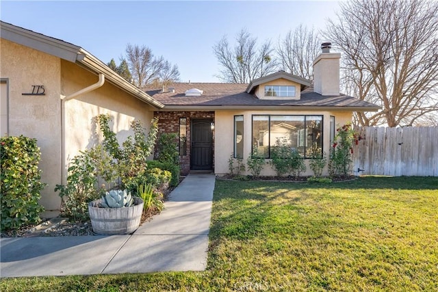 property entrance with a yard