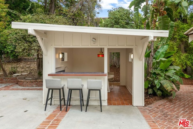 view of patio with an outdoor bar