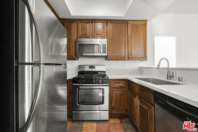 kitchen with sink and appliances with stainless steel finishes