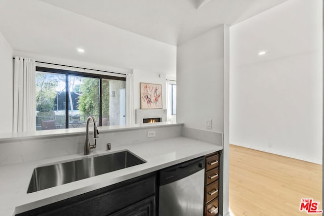 kitchen featuring sink, light hardwood / wood-style flooring, and dishwasher