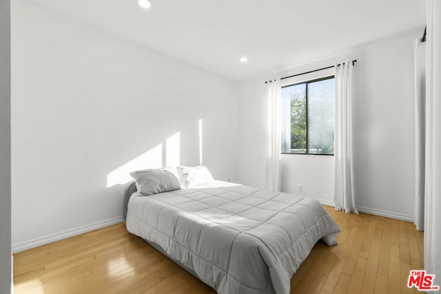 bedroom with light hardwood / wood-style flooring