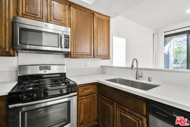 kitchen featuring stainless steel appliances and sink