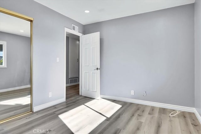 unfurnished bedroom featuring wood-type flooring