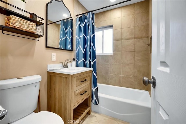 full bathroom featuring toilet, vanity, and shower / bathtub combination with curtain