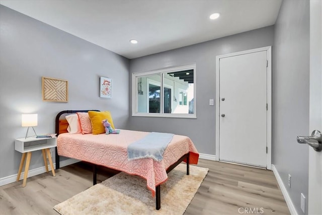 bedroom with light hardwood / wood-style flooring