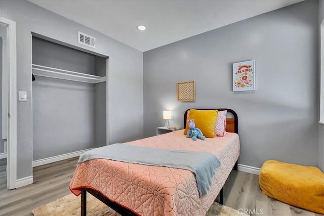 bedroom featuring a closet and hardwood / wood-style floors