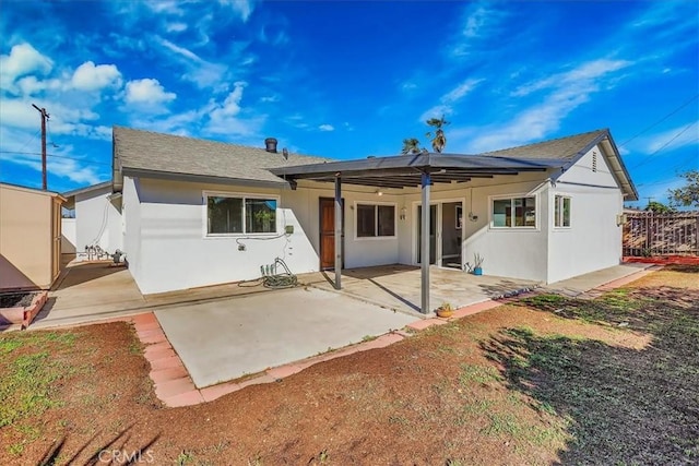 rear view of property featuring a patio