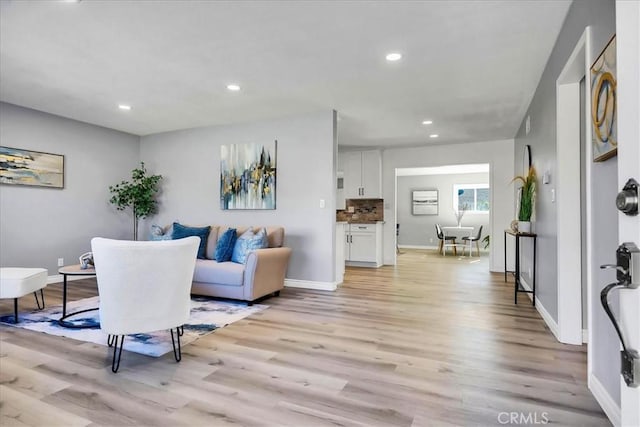 living room with light hardwood / wood-style floors