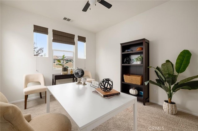 office with ceiling fan and light carpet