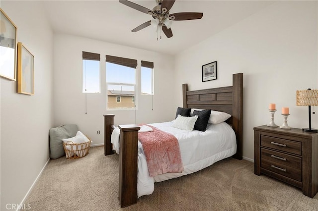 bedroom featuring light colored carpet and ceiling fan