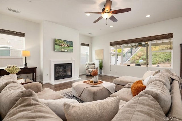 living room featuring hardwood / wood-style flooring and ceiling fan