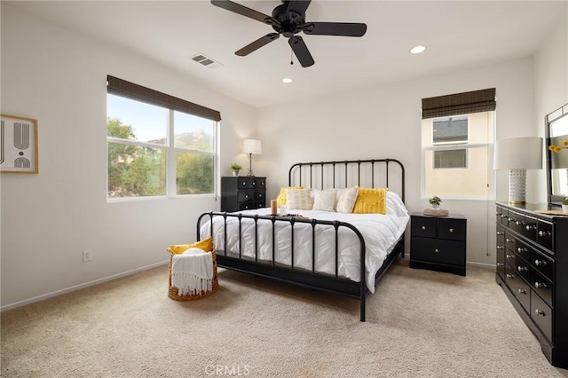 carpeted bedroom featuring ceiling fan