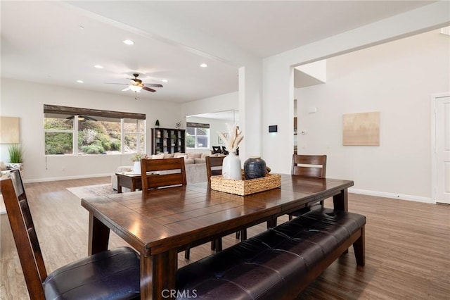 dining space featuring ceiling fan and hardwood / wood-style flooring