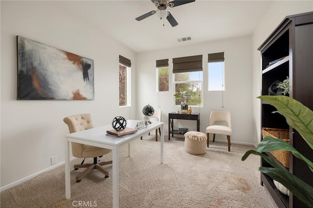 office space with carpet floors and ceiling fan