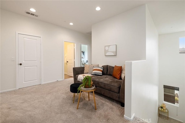 carpeted living room with heating unit