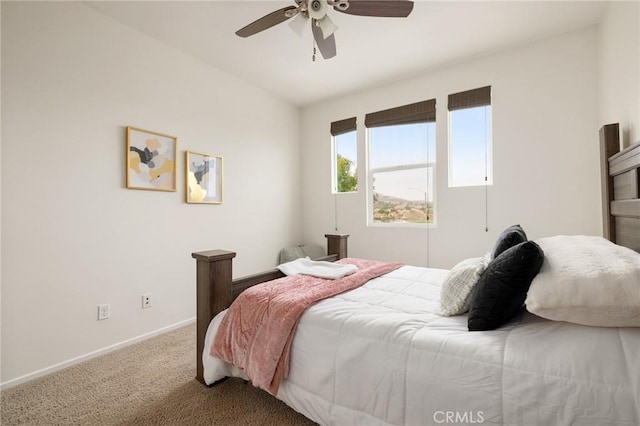 bedroom featuring ceiling fan, carpet floors, and lofted ceiling