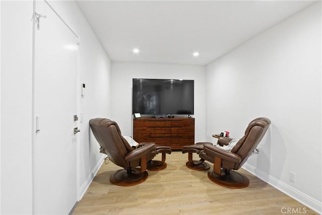 sitting room with light hardwood / wood-style floors