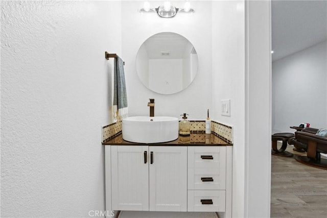 bathroom featuring hardwood / wood-style floors and vanity