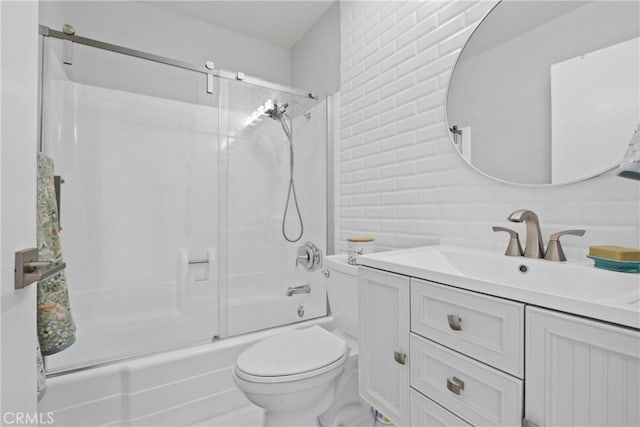 full bathroom with toilet, vanity, bath / shower combo with glass door, and tasteful backsplash