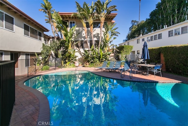 view of swimming pool with a patio