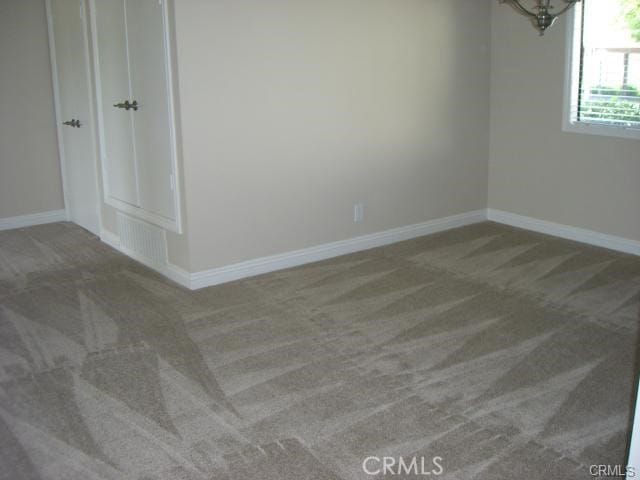 unfurnished room with carpet