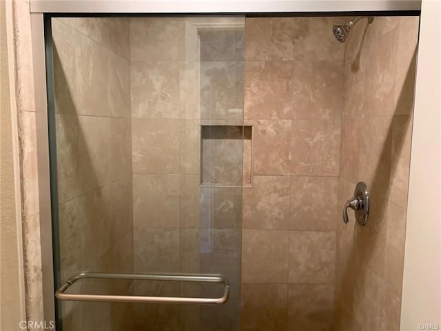 bathroom featuring an enclosed shower