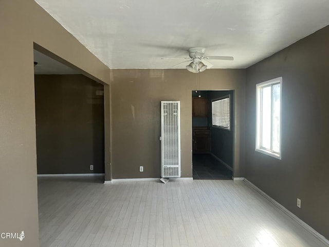 empty room featuring hardwood / wood-style floors and ceiling fan