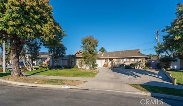 ranch-style house with a front lawn